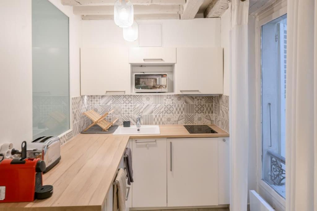 Cosy Appartement En Plein Marais Parigi Esterno foto